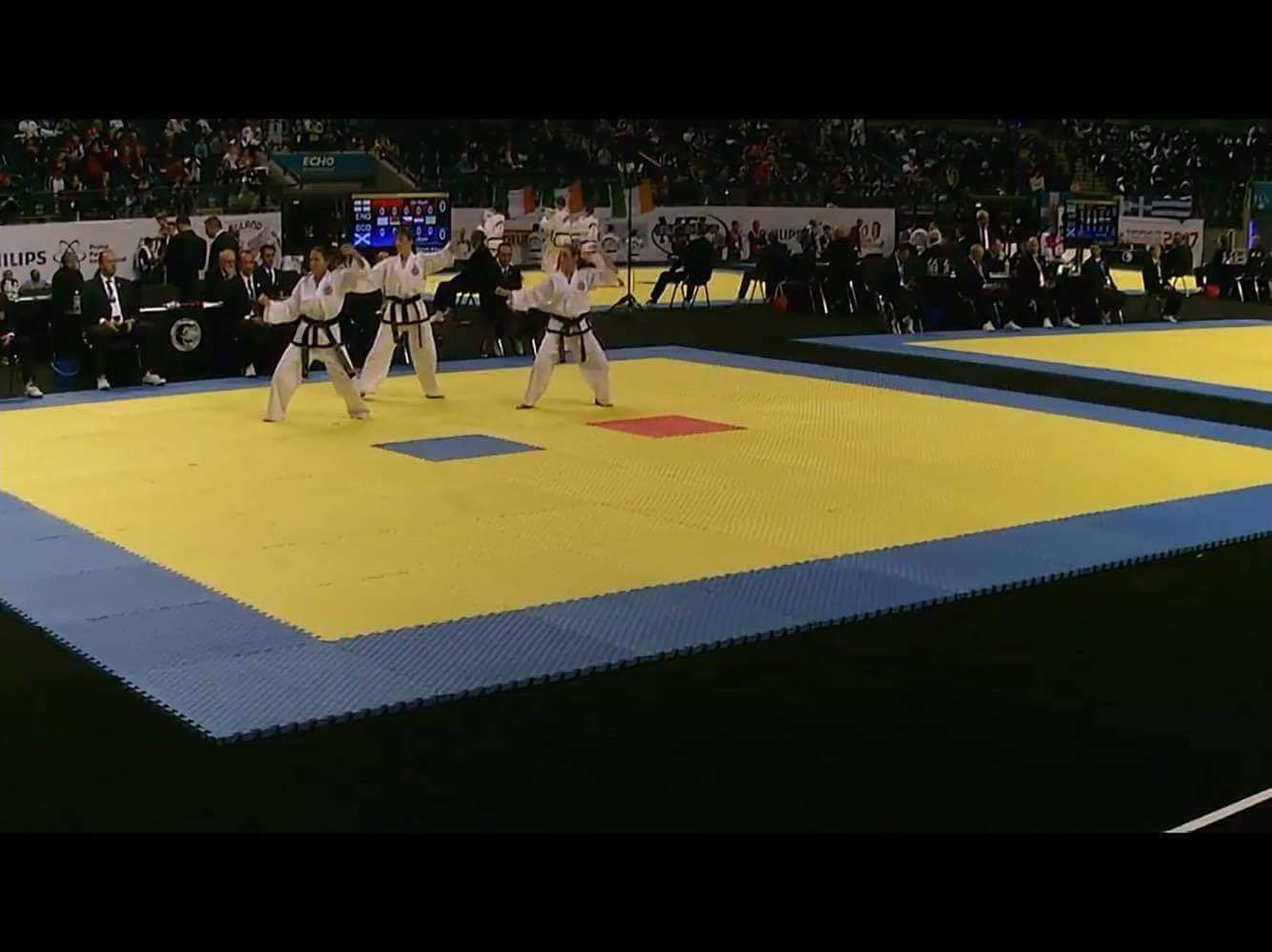 three women martial artists performing a taekwon-do pattern at the liverpool 2017 european ITF Taekwon-do championships